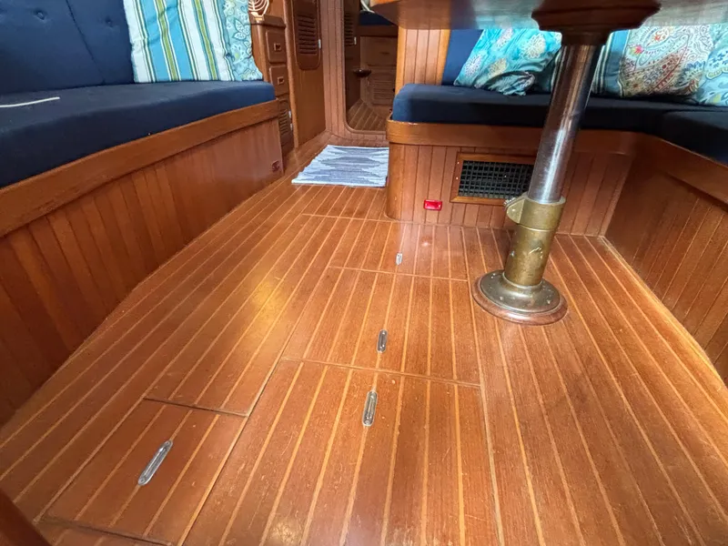 Slide: The Image of 1987 Ta Shing Tashiba 36 interior with wooden flooring and cushioned seating. - 44