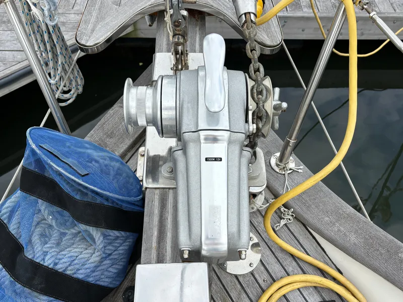 Slide: The Image of Anchor windlass on 1987 Ta Shing Tashiba 36 sailboat deck with blue rope bag. - 5