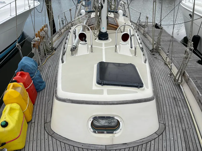 Slide: The Image of 1987 Ta Shing Tashiba 36 sailboat deck with fuel containers and ropes at dock. - 6