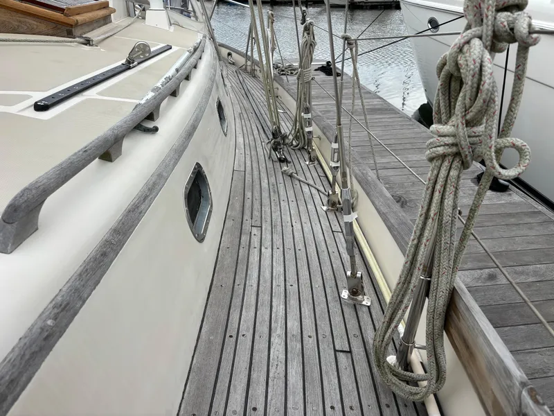 Slide: The Image of 1987 Ta Shing Tashiba 36 sailboat deck with wooden finish and rigging ropes. - 8