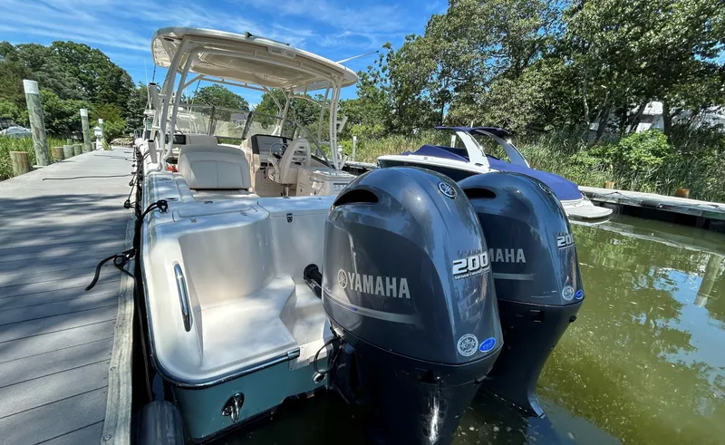 Slide: The Image of 2016 Grady-White Freedom 275 boat docked with twin Yamaha 200 engines. - 6