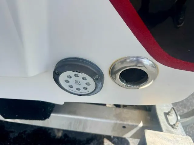 Slide: The Image of 2017 Blazer Bay 2170 boat detail showing a light and exhaust port. - 10