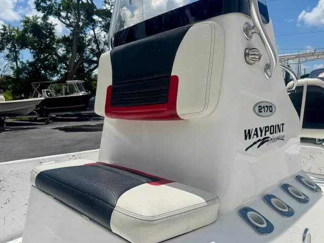 Slide: The Image of 2017 Blazer Bay 2170 boat console with seating, featuring Waypoint Marine branding. - 17