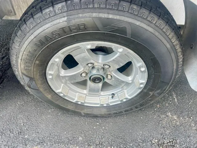 Slide: The Image of 2017 Blazer Bay 2170 wheel with Tow-Master tire on asphalt surface. - 22