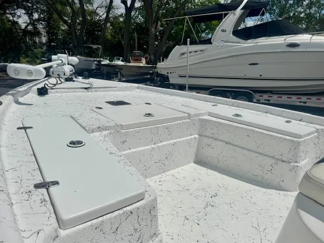 Slide: The Image of 2017 Blazer Bay 2170 boat with spacious deck and storage compartments. - 23