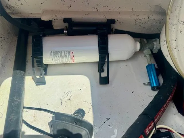 Slide: The Image of 2017 Blazer Bay 2170 boat compartment with mounted equipment and wiring. - 30