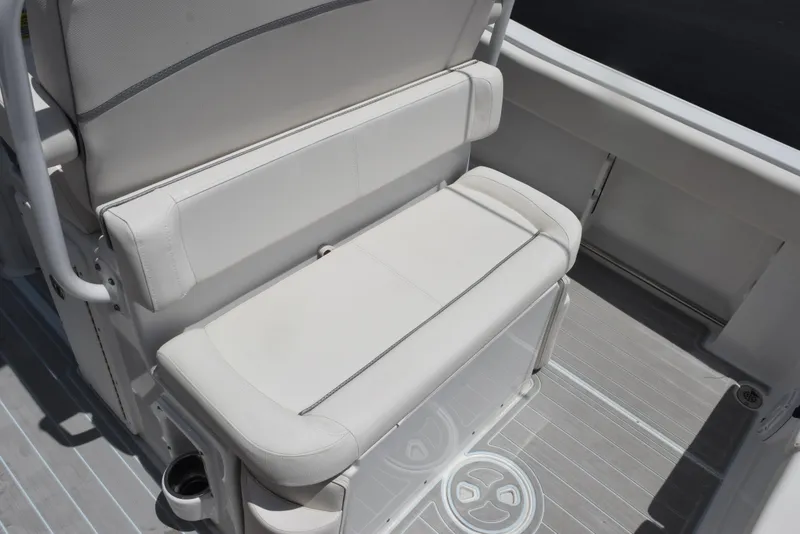 Slide: The Image of 2023 Sea Hunt Ultra 234 boat interior with cushioned seating and sleek design. - 14