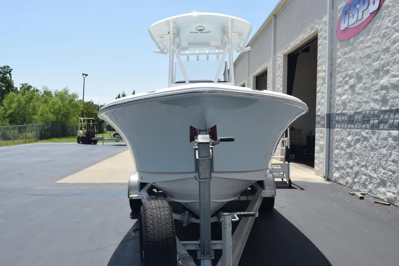 Slide: The Image of 2023 Sea Hunt Ultra 234 boat on trailer outside a building. - 3
