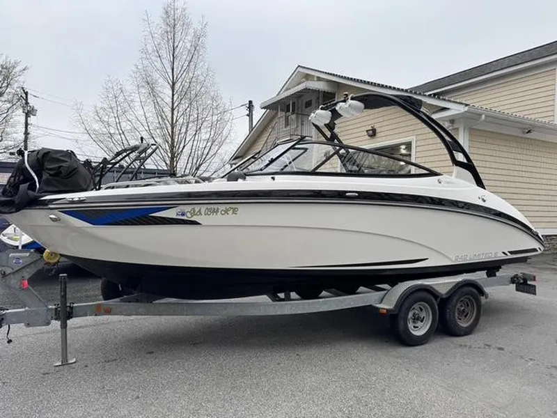 Slide: The Image of 2016 Yamaha Boats 242 Limited S on trailer, parked outdoors. - 13