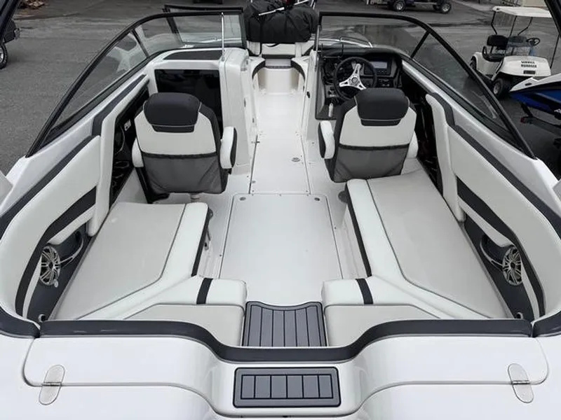 Slide: The Image of 2016 Yamaha Boats 242 Limited S interior with sleek seating and modern dashboard. - 3