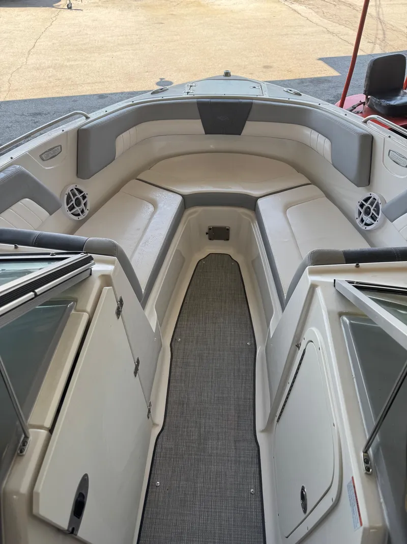 Slide: The Image of 2021 Chaparral 23ssi boat interior with spacious seating and modern design. - 9