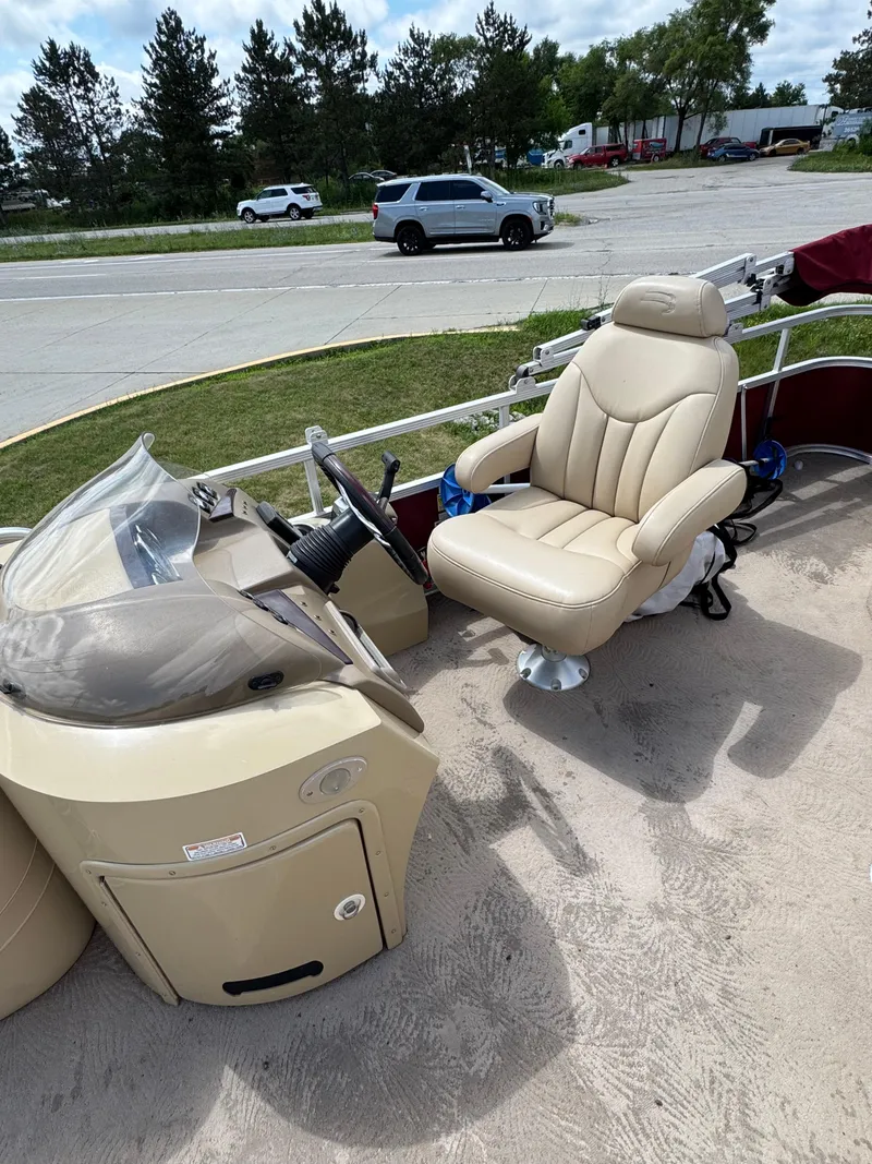 Slide: The Image of 2008 Bennington 2275RLi boat interior with captain's chair and steering console. - 12