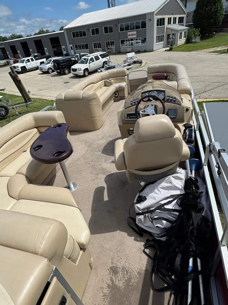 Slide: The Image of 2008 Bennington 2275RLi pontoon boat with beige seating and a central steering console. - 16