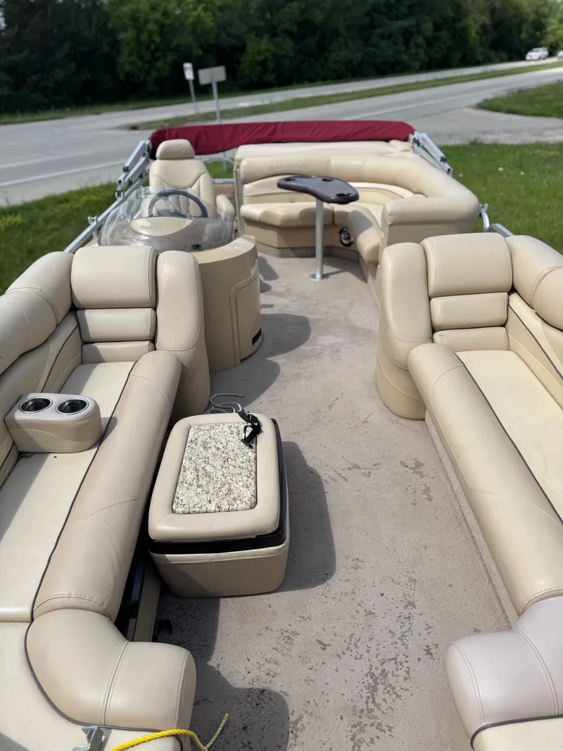 Slide: The Image of 2008 Bennington 2275RLi pontoon boat with beige seating and red canopy. - 7