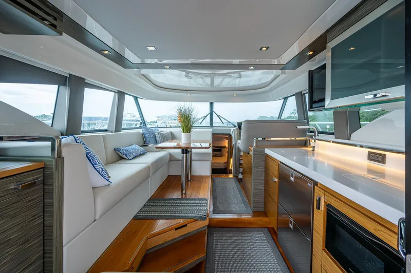 Slide: The Image of Luxurious interior of 2020 Tiara Yachts C44 Coupe with modern kitchen and seating area. - 42