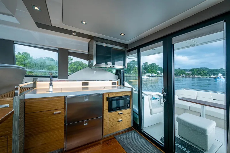Slide: The Image of Modern interior of 2020 Tiara Yachts C44 Coupe with sleek kitchen and scenic water view. - 46