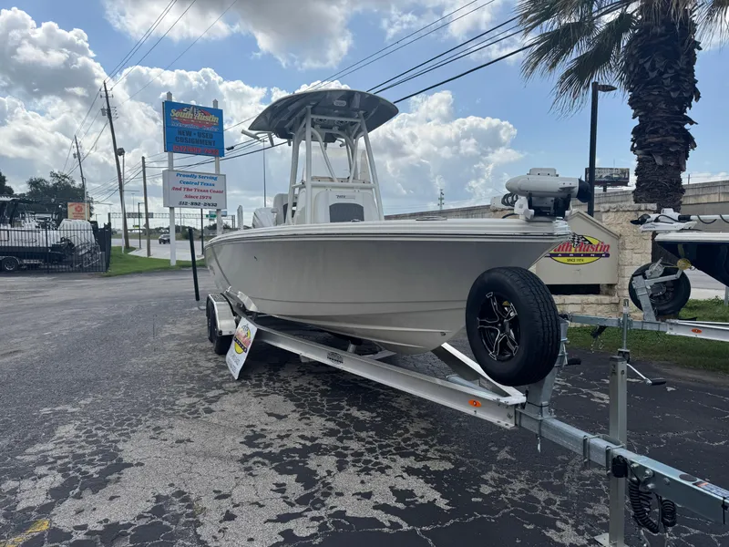 Slide: The Image of 2025 Pathfinder 2400 TRS boat on trailer under cloudy sky. - 10