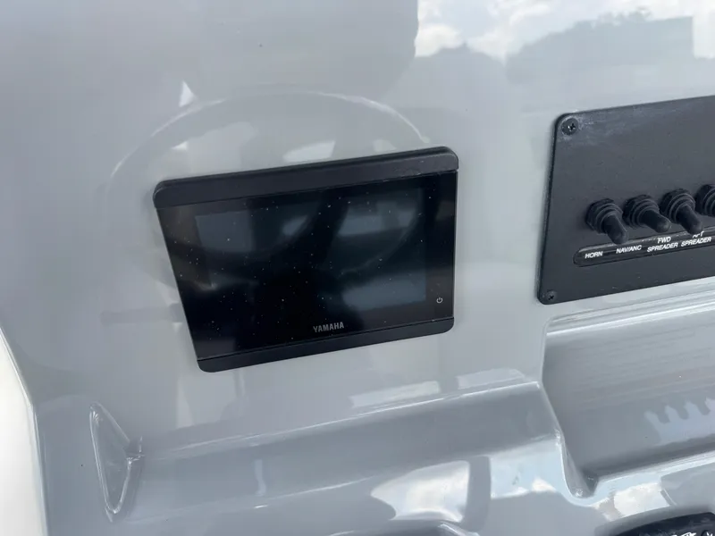 Slide: The Image of 2025 Pathfinder 2400 TRS dashboard with Yamaha display and control switches. - 14