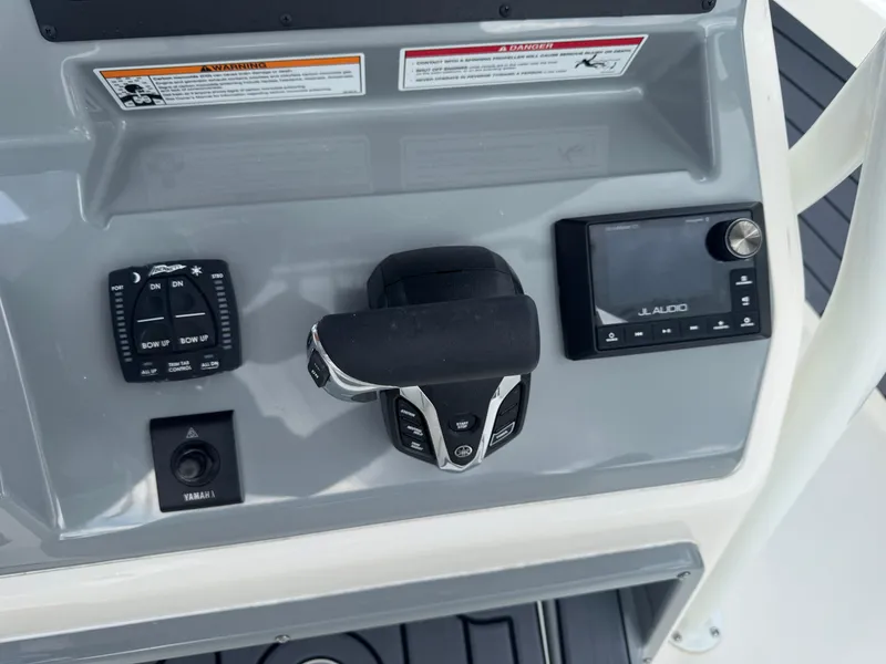 Slide: The Image of Control panel of 2025 Pathfinder 2400 TRS boat with Yamaha and JL Audio systems. - 16