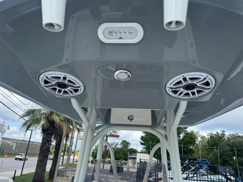 Slide: The Image of 2025 Pathfinder 2400 TRS boat speakers and lighting on T-top. - 22