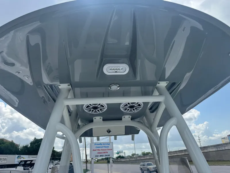 Slide: The Image of 2025 Pathfinder 2400 TRS boat T-top with speakers and lighting, viewed from below. - 23