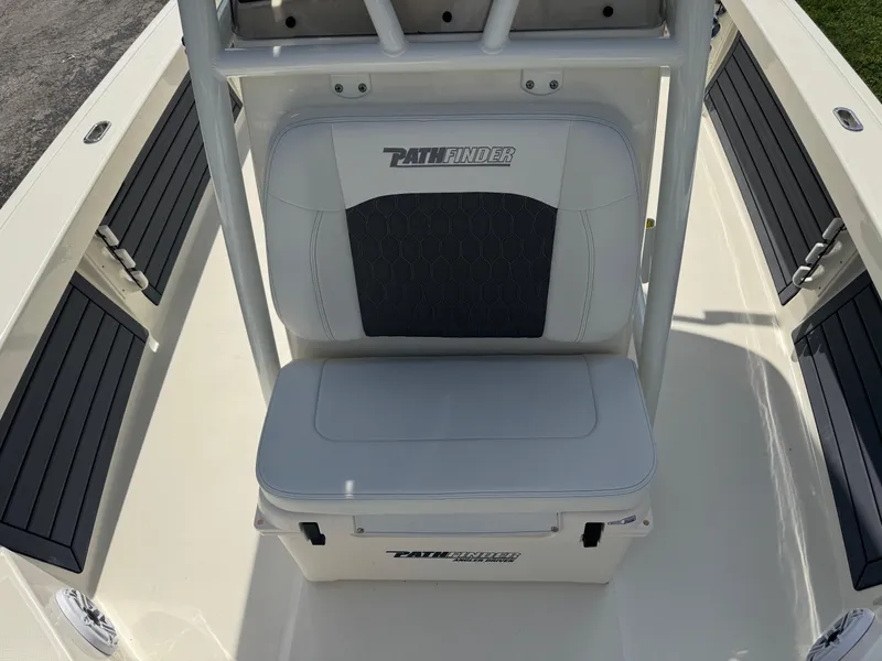 Slide: The Image of 2025 Pathfinder 2400 TRS boat seating area with storage compartment. - 29