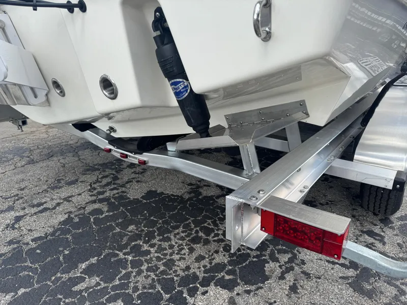 Slide: The Image of 2025 Pathfinder 2400 TRS boat on trailer, showcasing rear hull and trailer details. - 3