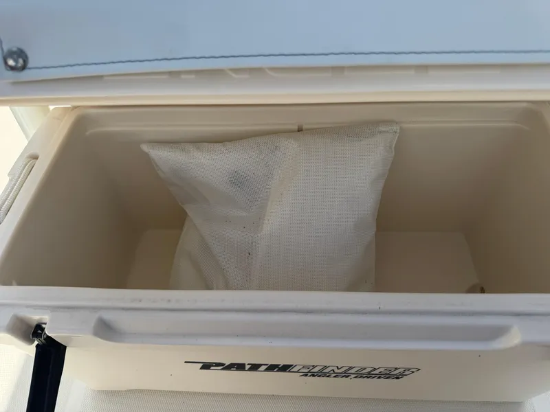 Slide: The Image of Open Pathfinder cooler with a white mesh bag inside, model 2400 TRS, year 2025. - 30