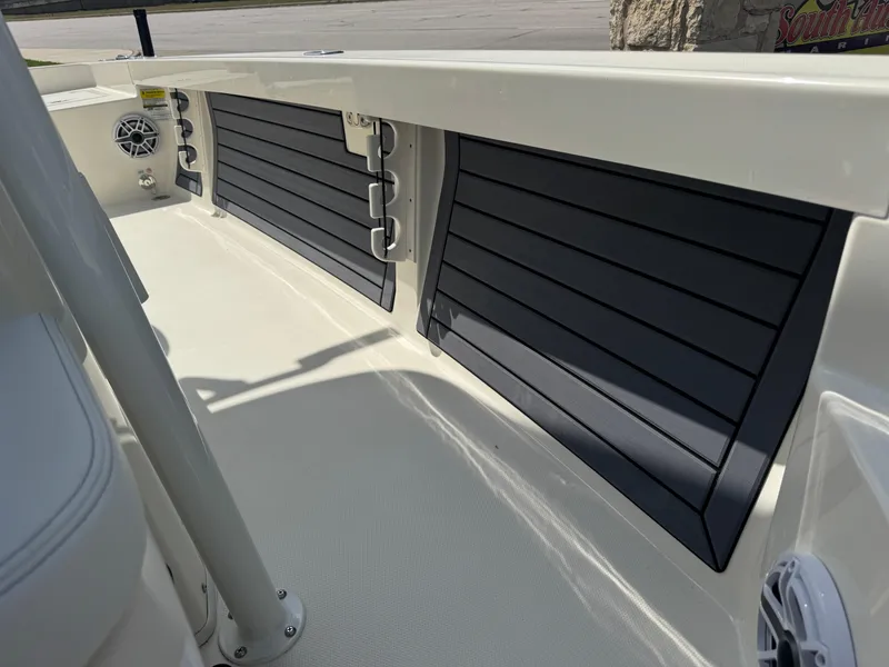 Slide: The Image of 2025 Pathfinder 2400 TRS boat interior with sleek black paneling and speaker. - 31