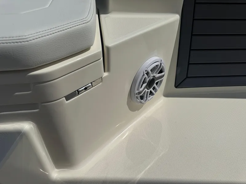Slide: The Image of 2025 Pathfinder 2400 TRS boat interior with speaker and cushioned seating. - 34