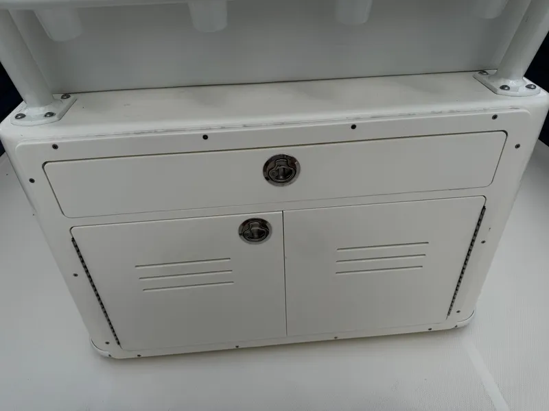 Slide: The Image of White storage compartment on a 2025 Pathfinder 2400 TRS boat. - 39