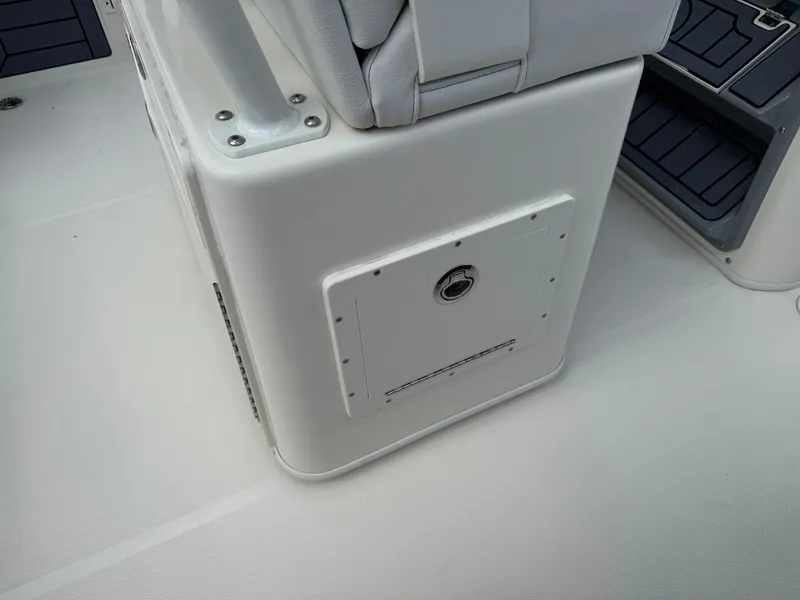 Slide: The Image of 2025 Pathfinder 2400 TRS boat interior, featuring a storage compartment and seating area. - 42
