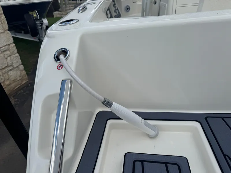 Slide: The Image of Pathfinder 2400 TRS 2025 boat deck with hose attachment and sleek design. - 7