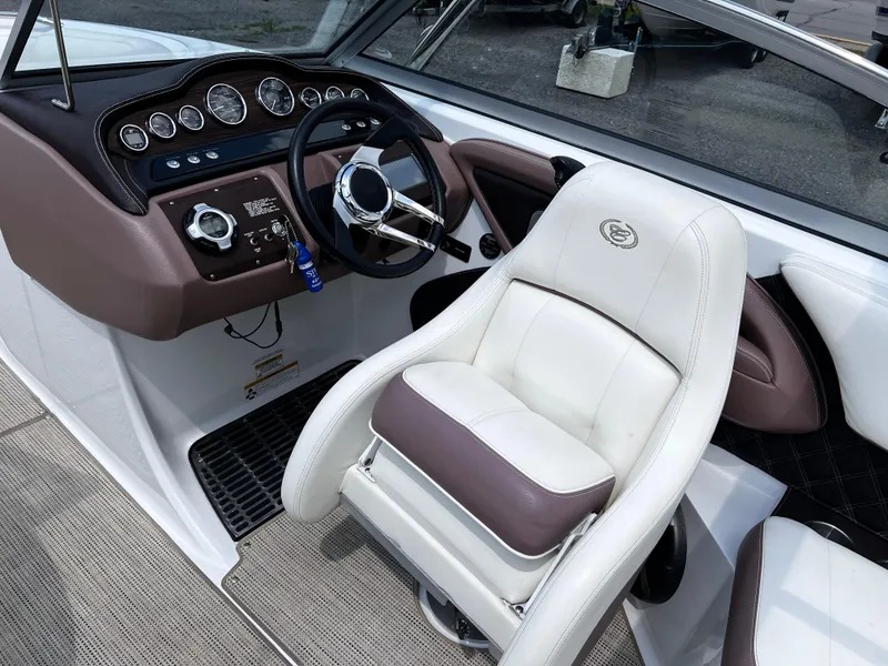 Slide: The Image of Interior of 2013 Cobalt 262 boat with steering wheel and captain's chair. - 5