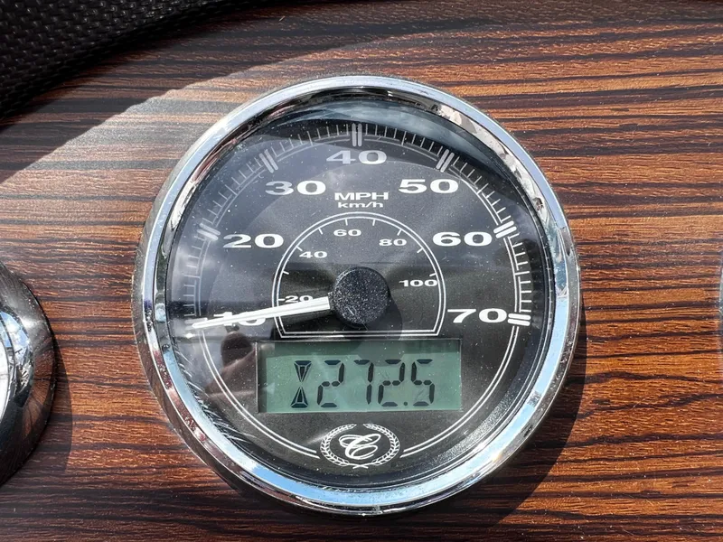 Slide: The Image of Speedometer of 2013 Cobalt 262 boat, displaying 12.5 MPH on wood grain dashboard. - 6