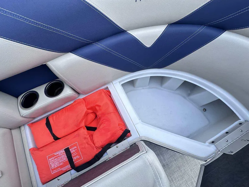 Slide: The Image of 2022 Trifecta 22 CL E boat interior with life jackets and storage compartment. - 5