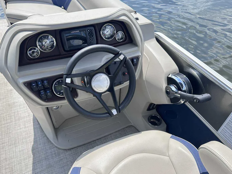 Slide: The Image of Steering console of 2022 Trifecta 22 CL E boat with gauges and controls. - 8