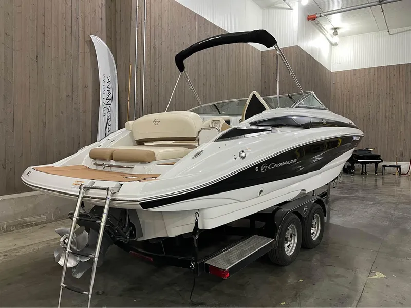 Slide: The Image of 2016 Crownline E-4 Bowrider boat on trailer in indoor storage. - 1
