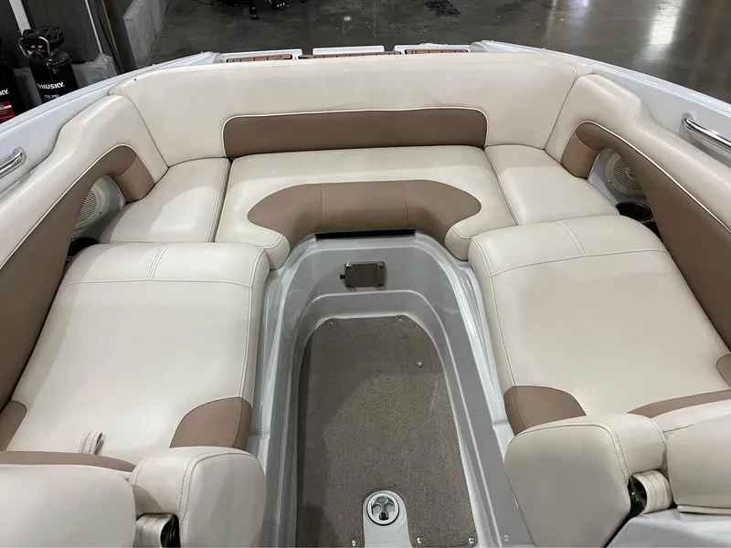 Slide: The Image of 2016 Crownline E-4 Bowrider interior with beige and brown cushioned seating. - 14