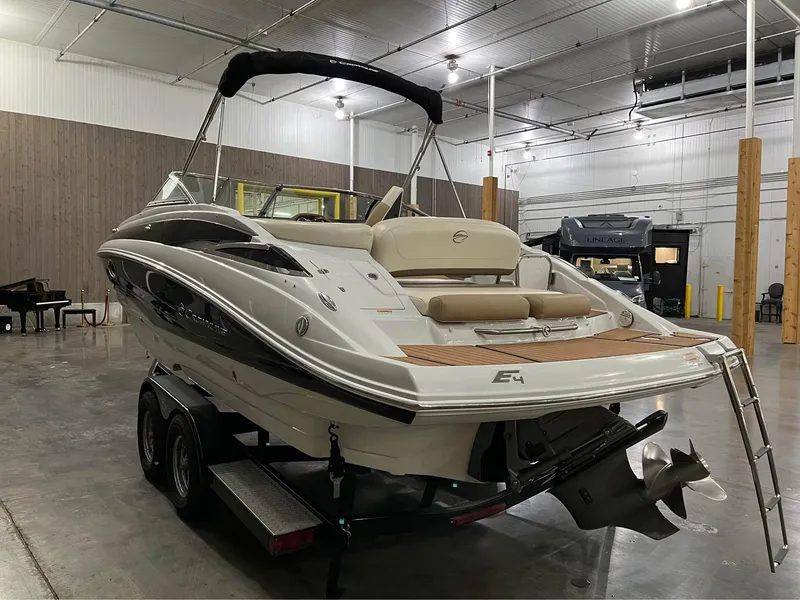 Slide: The Image of 2016 Crownline E-4 Bowrider boat in indoor storage, rear view. - 2