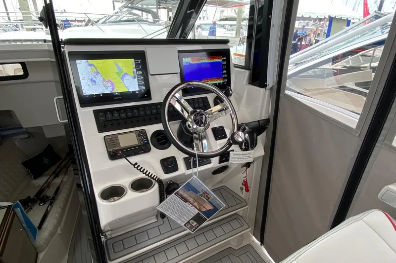 Slide: The Image of Cockpit of 2025 Solara S-310 CW boat with advanced navigation systems and controls. - 5