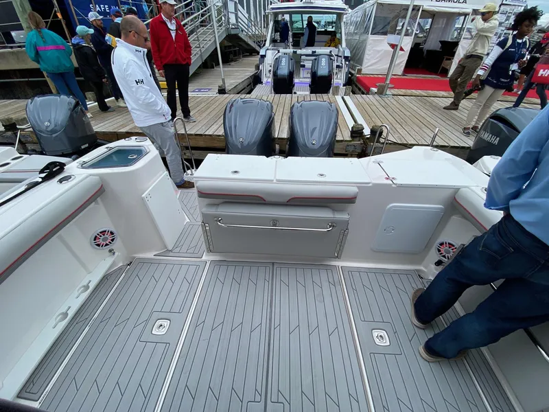 Slide: The Image of 2025 Solara S-310 CW boat deck with Yamaha engines at a marina event. - 8