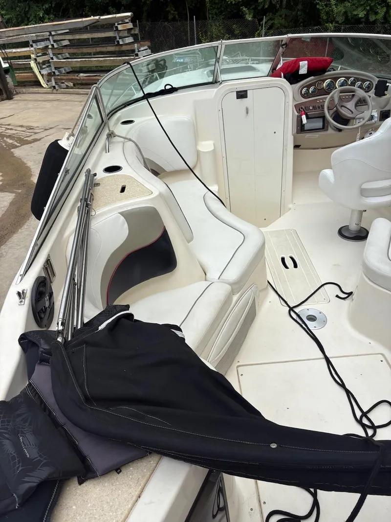 Slide: The Image of 2000 Rinker 272 Captiva Cuddy boat interior with seating and dashboard. - 8