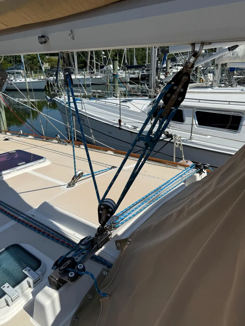 Slide: The Image of 1987 Island Packet 38 sailboat deck with rigging and marina view. - 3