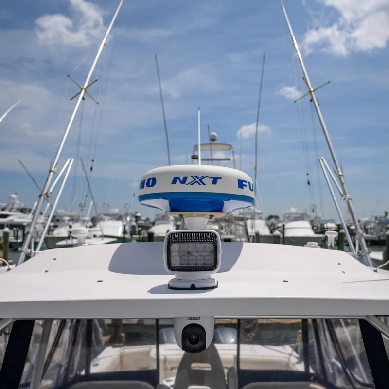 Slide: The Image of 2003 Grady-White Express 330 boat with radar and antennas at marina. - 27