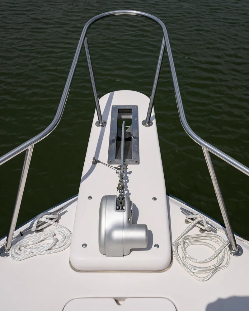 Slide: The Image of Bow of 2003 Grady-White Express 330 boat with anchor and ropes. - 23