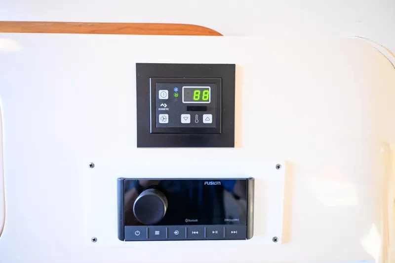 Slide: The Image of Control panel and stereo system on 2003 Grady-White Express 330 boat. - 18