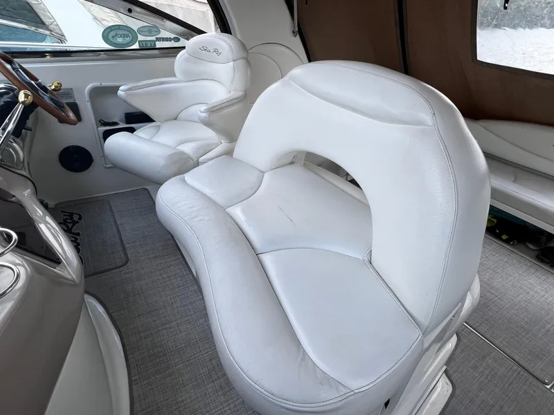 Slide: The Image of Interior of 2000 Sea Ray 380 Sundancer with white leather seating and helm. - 11