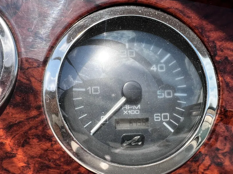 Slide: The Image of Tachometer of 2000 Sea Ray 380 Sundancer, displaying RPM with wood grain panel. - 16