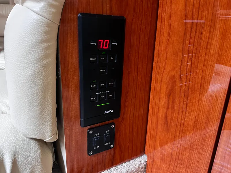 Slide: The Image of Control panel on 2000 Sea Ray 380 Sundancer yacht, featuring temperature settings. - 26